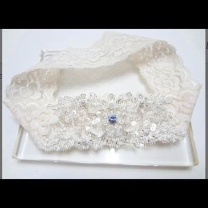 White lace bridal garter with blue stone accent